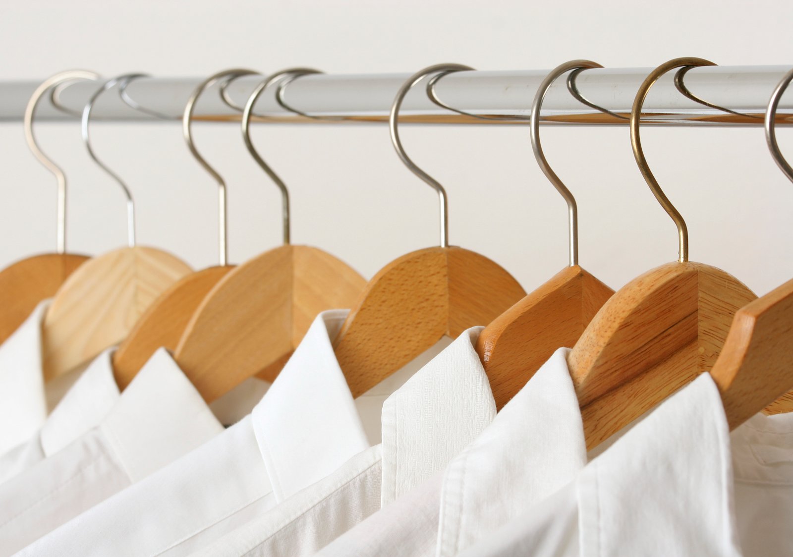 Pressed white shirts on hangers